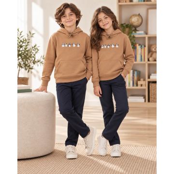 Kidley camel brown penguin hoodie styled as part of a child’s casual outfit